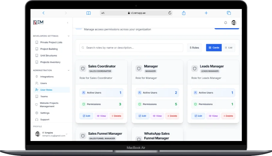 REM CRM user roles and permissions dashboard on a MacBook Air, displaying roles like Sales Coordinator, Manager, and Leads Manager with active users, permission counts, and edit, view, or delete options.